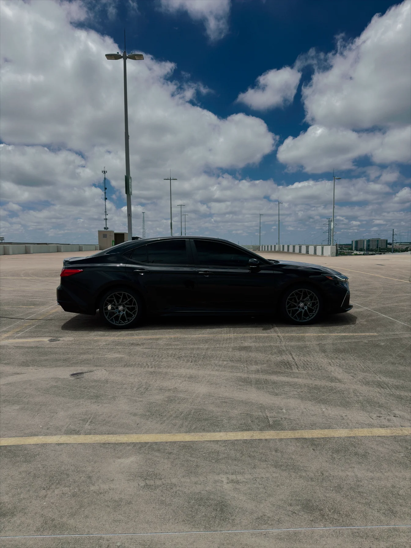 Black Hansom sedan photographed on an Austin rooftop